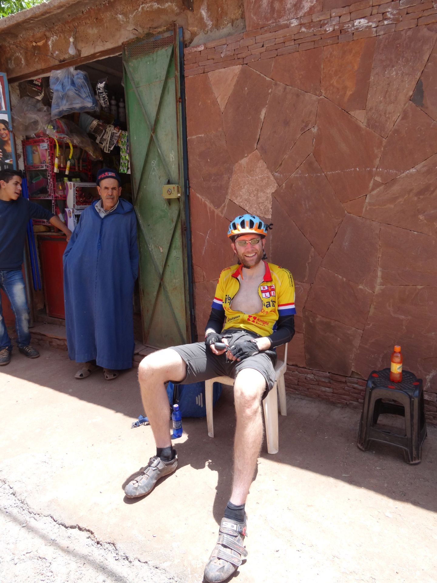 Day 7- Resting up in the shade, readying to drink orange liquid sugar, during the steady 6-hour climb up the "Ouka Monster". © Steve Woodward
