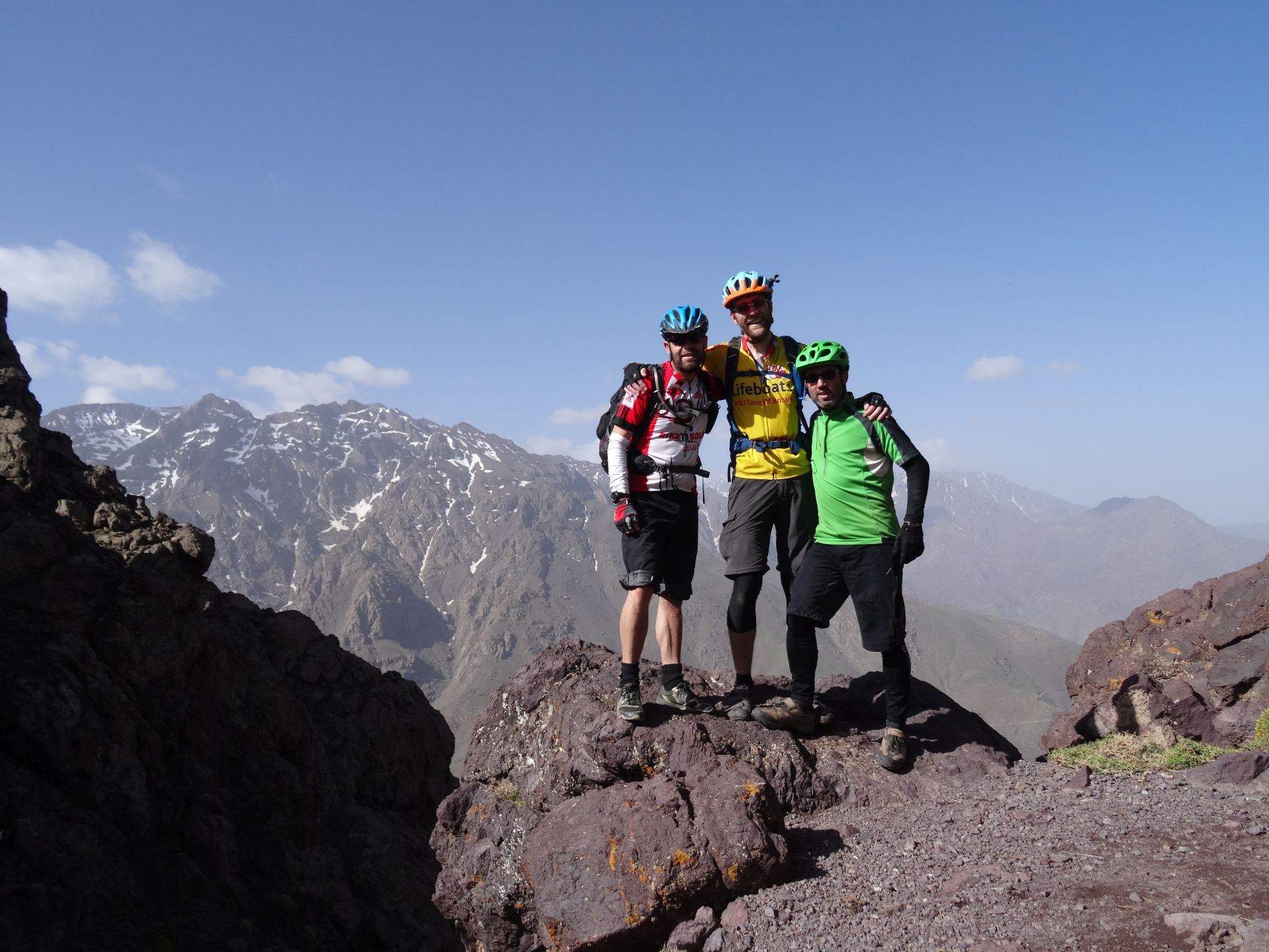Day 8 - Made it! Thanks lads! A suitable rock near the high point of our trip, the Tizi-n-Eddi pass (9,606 ft). Jbel Aksoual (12,828 ft) is the highest peak on the left. © Steve Woodward