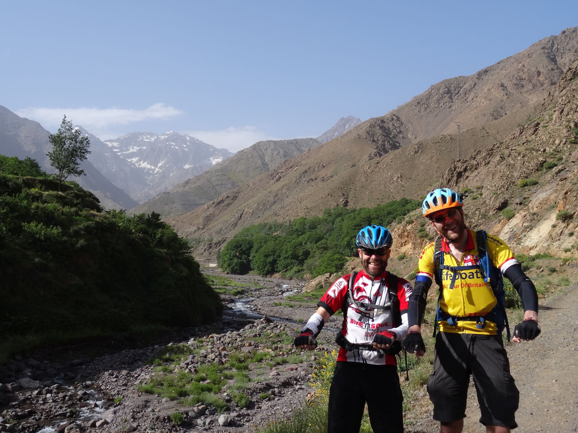 Day 9 - It`s been a long two weeks on the road! We`re on our bikes, right? Right? ;) "Riding" beside the Oued Rheraya river, on the way back to Marrakesh. The mountain on the left is the highest peak in North Africa, Jbel Toubkal (13,671 ft). Crikey. © Steve Woodward