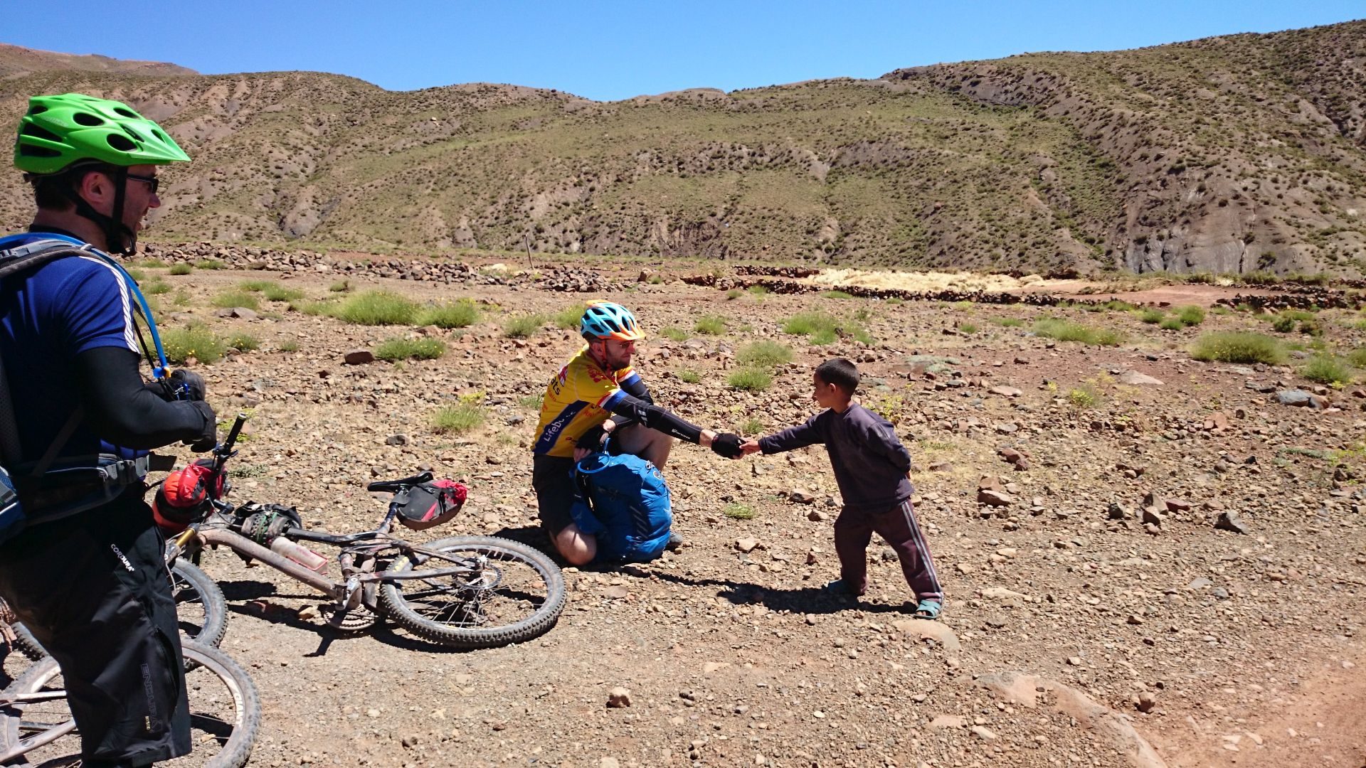 Day 6 - Jon to friendly kid: "Ok sir, $300 for an ice cream, it`s a deal!" (the heat from the sun is incredibly intense by this point, & it`s not even noon yet). Near Tamzrit. © Shaun Grey