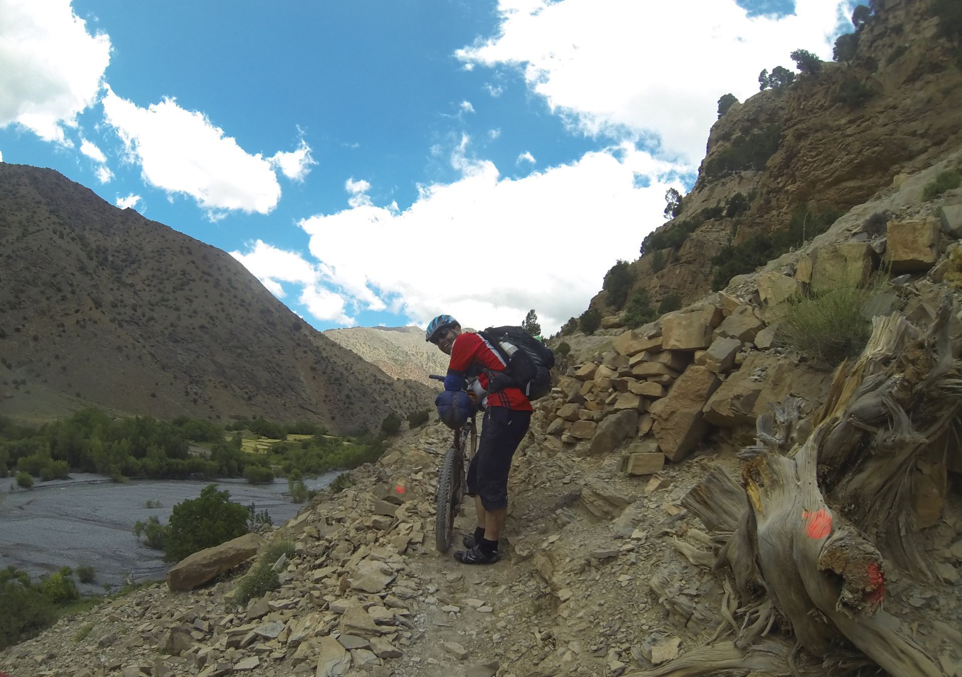Day 5 - Trail-demon Shaun, nearing the end of the singletrack, but the trickiness of the riding is not letting up! Note the orange dots leading the way.  Approaching Toufghine, Tassaout valley