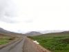 Day 1 - In amongst the moonscape there are joyous surprises like this huge green meadow - life-affirming! Looking toward  Tizi-n-Ouanergui pass, with the huge Afella-n-Imeral ridge on the horizon just right of centre (in the haze). © Steve Woodward
