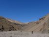 Day 6 - The moon, again. Seemingly-endless dried-up riverbed, beneath Tizi-n-Tamadla pass. Very, very slow going! © Steve Woodward