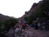 Day 6 - Getting dark, but not there yet! Food & nav break in the dust. Hauling bikes over boulders as big as us is now the norm :( Slow, slow going. On the trail toward Tighza © Steve Woodward