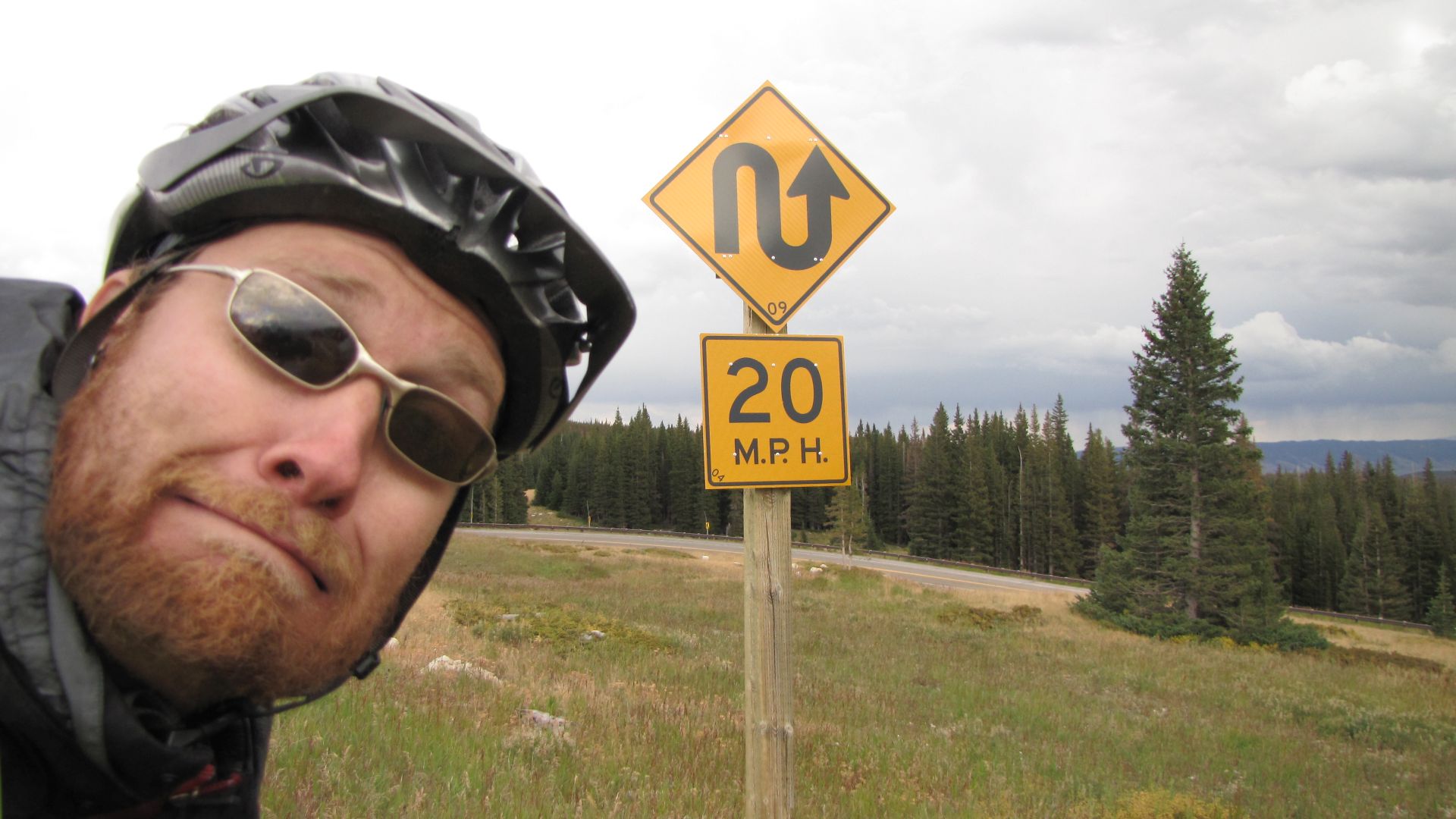 Snowy Mt Pass, WY, USA - What loon came up with this sign?!  Its great tho and apart from the 2nd hairpin & a later cattle grid I didn`t brake for 10 MILES!