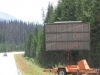 Kootenay Nat Pk, BC, Canada - Just in case you can`t read it, it says "Caution Wolf on Highway" & was followed by "Do not stop".  For 10 miles!  I rode fast! Didn`t see it.  Apparently some numb-nut had fed it from a car window so it was coming back looking for easy food (Rangers were using plastic bullets to scare it away)